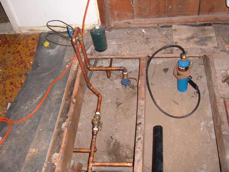 Fixing the Retro-House plumbing.