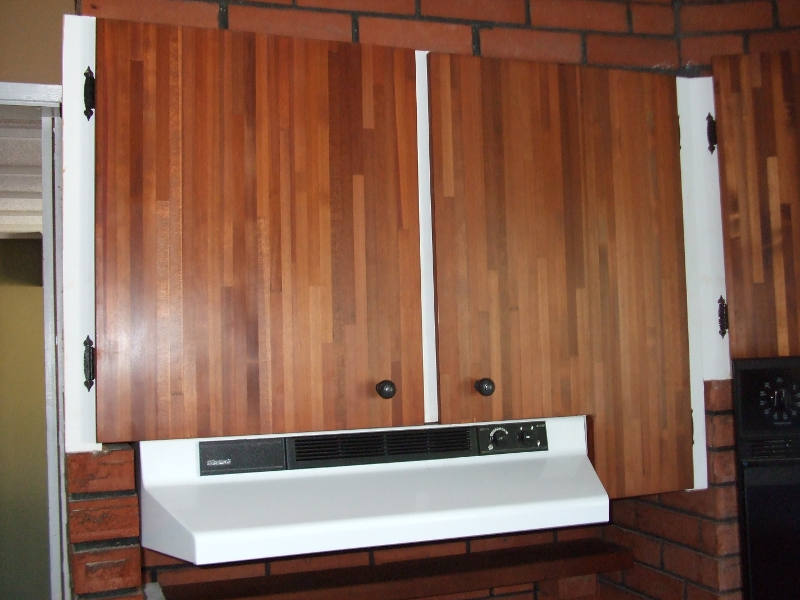 Refinishing The Kitchen Cabinets.