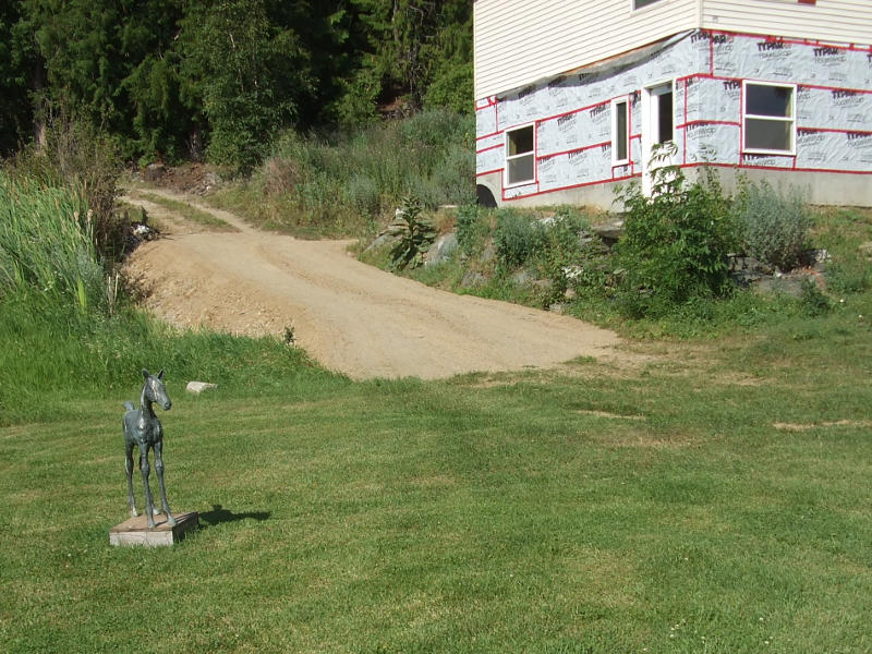 Back Driveway Sloped And Graded.