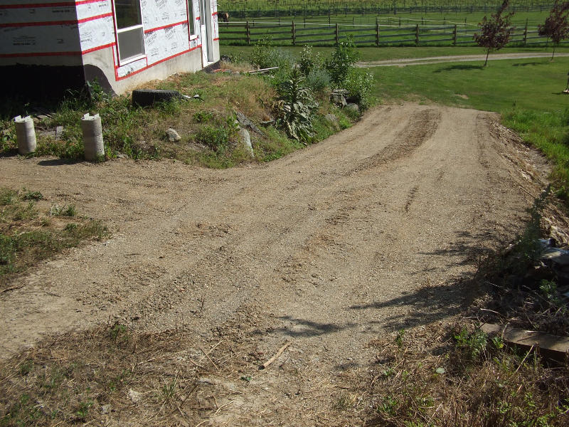 Back Driveway Sloped And Graded.